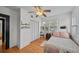 Bedroom showcasing hardwood floors, a ceiling fan, a closet, and natural light from a window at 6251 4Th S Ave, St Petersburg, FL 33707
