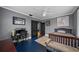 Spacious bedroom featuring hardwood floors, comfortable seating, and ample natural light at 6251 4Th S Ave, St Petersburg, FL 33707