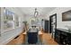 Bright dining room featuring a wood table, blue chairs, and large windows at 6251 4Th S Ave, St Petersburg, FL 33707