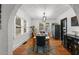 Elegant dining room with hardwood floors and natural light, perfect for meals and social gatherings at 6251 4Th S Ave, St Petersburg, FL 33707