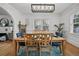 Dining room with blue chairs, hardwood floors, and views to other rooms at 6251 4Th S Ave, St Petersburg, FL 33707
