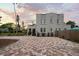 Charming two-story home with a patterned driveway and landscaped front yard, offering curb appeal and inviting entrance at 6251 4Th S Ave, St Petersburg, FL 33707