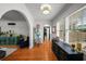 A stylish room with gleaming hardwood floors, natural light, and neutral walls at 6251 4Th S Ave, St Petersburg, FL 33707