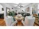 Open-concept living room with stylish seating, hardwood floors, and archway to dining area at 6251 4Th S Ave, St Petersburg, FL 33707
