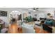 Spacious living room with an archway to the dining area, plants, and comfortable seating at 6251 4Th S Ave, St Petersburg, FL 33707