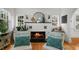 Bright living room featuring a charming fireplace, elegant decor, and cozy seating, ideal for comfortable living at 6251 4Th S Ave, St Petersburg, FL 33707