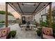 Enjoy a relaxing meal on the paved patio with a pergola, adjacent to the pool and outdoor lounging area at 6251 4Th S Ave, St Petersburg, FL 33707