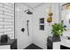 Walk-in shower featuring subway tile surround, overhead rainfall showerhead and built-in niche at 6251 4Th S Ave, St Petersburg, FL 33707