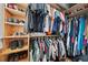 Organized walk-in closet with shelves and hanging rods providing ample storage space for clothes and shoes at 6251 4Th S Ave, St Petersburg, FL 33707