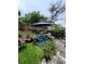 Inviting backyard with a lounge chair, comfortable seating, and well-manicured landscaping at 6318 Ridge Crest Dr, Port Richey, FL 34668