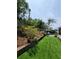 Lovely backyard offers both lush landscaping and well-maintained artificial turf at 6318 Ridge Crest Dr, Port Richey, FL 34668