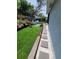 Inviting backyard features artificial grass, stepping stones, and comfortable seating at 6318 Ridge Crest Dr, Port Richey, FL 34668