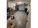 Spacious basement area perfect for storage or workshop featuring utility sink and ample lighting at 6318 Ridge Crest Dr, Port Richey, FL 34668