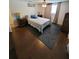 Comfortable bedroom featuring hardwood floors, ceiling fan, and neutral decor, creating a relaxing atmosphere at 6318 Ridge Crest Dr, Port Richey, FL 34668