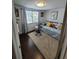 Bright bedroom with daybed, neutral rug, hardwood floors, and lots of natural light at 6318 Ridge Crest Dr, Port Richey, FL 34668