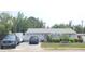 Charming single story home with a well-maintained lawn, featuring mature landscaping and a private driveway at 6318 Ridge Crest Dr, Port Richey, FL 34668