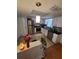 Bright kitchen featuring stainless steel appliances, granite countertops, and ample cabinet space at 6318 Ridge Crest Dr, Port Richey, FL 34668