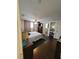 Cozy bedroom with hardwood floors, ceiling fan, and ensuite bath at 6318 Ridge Crest Dr, Port Richey, FL 34668