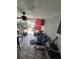 Enclosed patio with tile flooring, comfortable seating, and relaxing outdoor space at 6318 Ridge Crest Dr, Port Richey, FL 34668