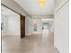 Inviting foyer with ceramic tile, built-in storage, and a sliding barn door to living spaces at 6670 Paden Wheel St, Zephyrhills, FL 33541