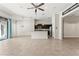 Open-concept living space featuring a kitchen and sliding glass doors to the outdoor pool at 6670 Paden Wheel St, Zephyrhills, FL 33541