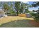 Large backyard with a mix of trees and clear space, perfect for outdoor enjoyment at 695 Sunset Dr, Tarpon Springs, FL 34689