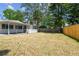 Spacious backyard featuring mature trees and well-maintained landscaping at 695 Sunset Dr, Tarpon Springs, FL 34689