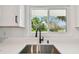 Modern kitchen sink with stylish faucet and a view of the outdoors from the window at 695 Sunset Dr, Tarpon Springs, FL 34689