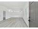 Light-filled living room showcasing new flooring, fresh paint, and large windows with natural light at 695 Sunset Dr, Tarpon Springs, FL 34689