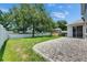 Backyard with a paver patio, shed, and well-maintained lawn at 7013 Early Gold Ln, Riverview, FL 33578