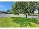 Large backyard featuring a vinyl privacy fence and mature shade trees at 7013 Early Gold Ln, Riverview, FL 33578