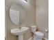 Bright half-bath features a pedestal sink and white fixtures at 7013 Early Gold Ln, Riverview, FL 33578