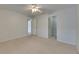 Bright bedroom featuring carpet, a ceiling fan, and access to the closet at 7013 Early Gold Ln, Riverview, FL 33578