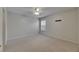 Bedroom featuring a ceiling fan, carpet, and a window providing natural light at 7013 Early Gold Ln, Riverview, FL 33578