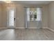 View of the spacious living room featuring luxury vinyl plank flooring at 7013 Early Gold Ln, Riverview, FL 33578