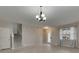 Bright living room features wood floors, staircase, and a large window allowing for an abundance of natural light at 7013 Early Gold Ln, Riverview, FL 33578
