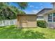 Backyard shed next to an AC unit and lush landscaping at 7013 Early Gold Ln, Riverview, FL 33578