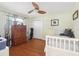 Guest bedroom features wood floors, a ceiling fan, and closet space at 71 Flamingo Cir, Safety Harbor, FL 34695