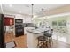 Updated kitchen with white cabinets, a center island with bar seating, and modern appliances at 71 Flamingo Cir, Safety Harbor, FL 34695