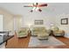 Cozy living room with comfortable seating arrangement and a view of the front entryway at 71 Flamingo Cir, Safety Harbor, FL 34695