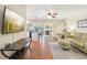 Open-concept living area featuring a fireplace, modern decor, and lots of natural light at 71 Flamingo Cir, Safety Harbor, FL 34695