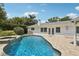 Enjoy this beautiful pool area with access to the home and featuring tranquil, clear water at 71 Flamingo Cir, Safety Harbor, FL 34695