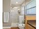 Beautifully renovated shower with white subway tile, a glass door, and built-in shelving at 71 Flamingo Cir, Safety Harbor, FL 34695