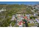 Aerial view of homes, waterways, and green spaces at 77 Gulfwinds Dr, Palm Harbor, FL 34683