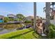 Exterior shot of the backyard and canal with boat lift at 77 Gulfwinds Dr, Palm Harbor, FL 34683