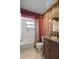 Well-maintained bathroom featuring a vanity, tiling, and shower-tub combo at 77 Gulfwinds Dr, Palm Harbor, FL 34683