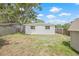 Back yard featuring a storage shed, grass, and partial wood fence at 7991 54Th N St, Pinellas Park, FL 33781