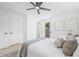 Bright bedroom with two closets, ceiling fan, and a door that leads to the backyard at 7991 54Th N St, Pinellas Park, FL 33781