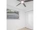 Bright bedroom features a window providing natural light, and a double door closet for storage at 7991 54Th N St, Pinellas Park, FL 33781