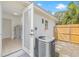 Exterior view of an outbuilding with white exterior and access to the back yard at 7991 54Th N St, Pinellas Park, FL 33781